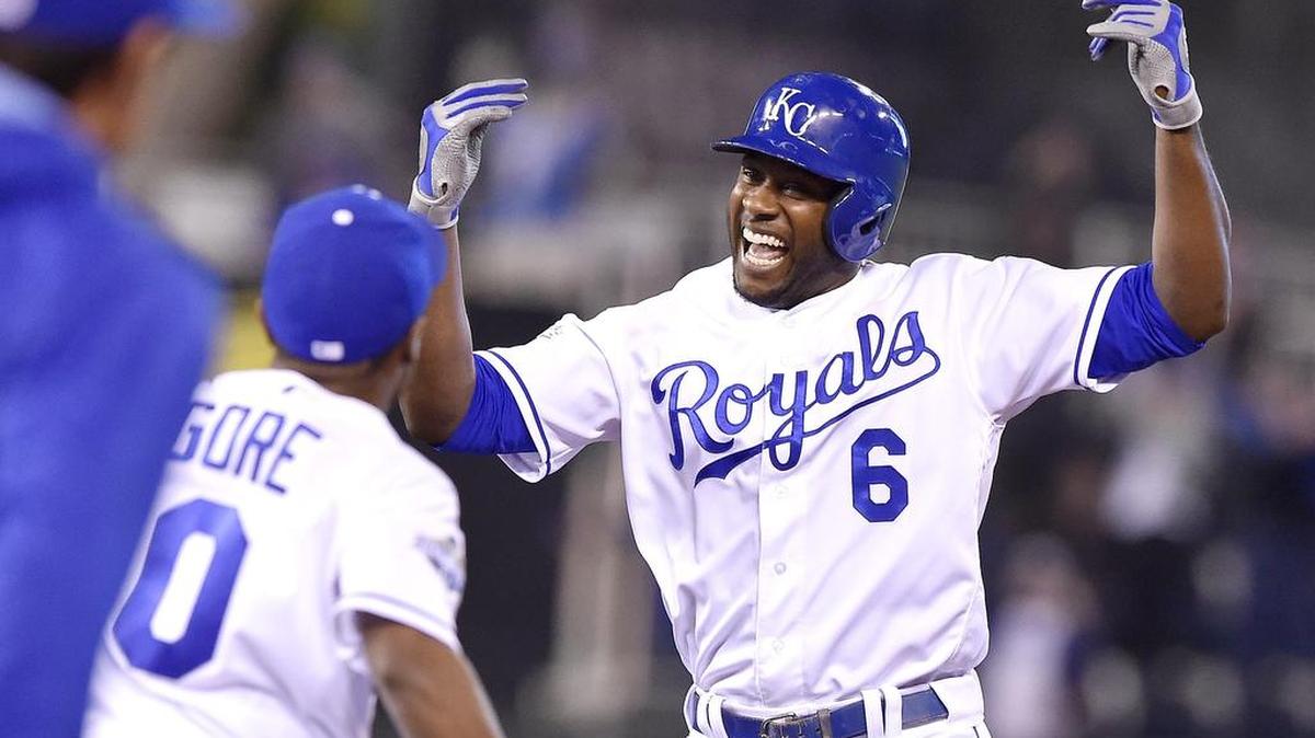 The Royals’ Lorenzo Cain celebrates with teammates after his game-winning hit in the ninth inning against the Nationals on Tuesday in Kansas City, Mo.