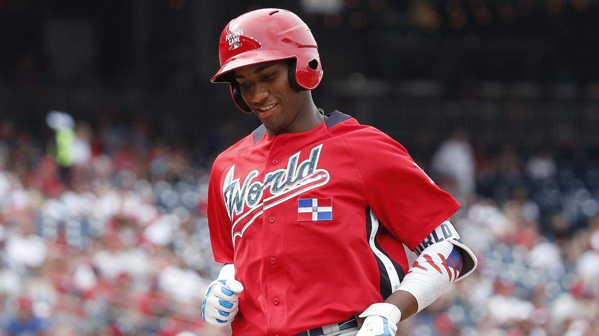 World Team Seuly Matias, of the Kansas City Royals, touches the plate after hitting a home run against the U.S. Team in the second inning of the All-Star Futures game Sunday Nationals Park, in Washington.