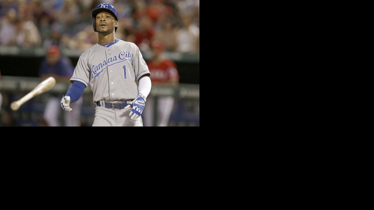 
Kansas City Royals Jarrod Dyson tosses his bat after taking a bases-loaded walk from Texas Rangers starting pitcher Nick Tepesch during the fifth inning Saturday in Arlington, Texas. 
