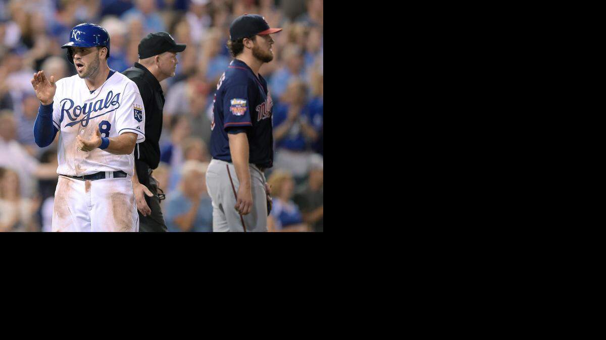 
The Royals’ Mike Moustakas celebrates after scoring the go-ahead run on a double by Nori Aoki in the eighth inning as Minnesota Twins starter Phil Hughes walked back to the mound Wednesday night at Kauffman Stadium. The Royals scored four more runs in the inning and went on to win 6-1.
