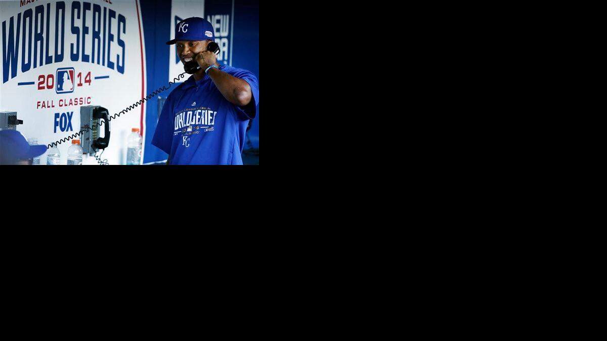 
Kansas City Royals shortstop Alcides Escobar talks on a dugout phone before Game 3 of baseball's World Series between the Kansas City Royals and the San Francisco Giants Friday, Oct. 24, 2014, in San Francisco. 
