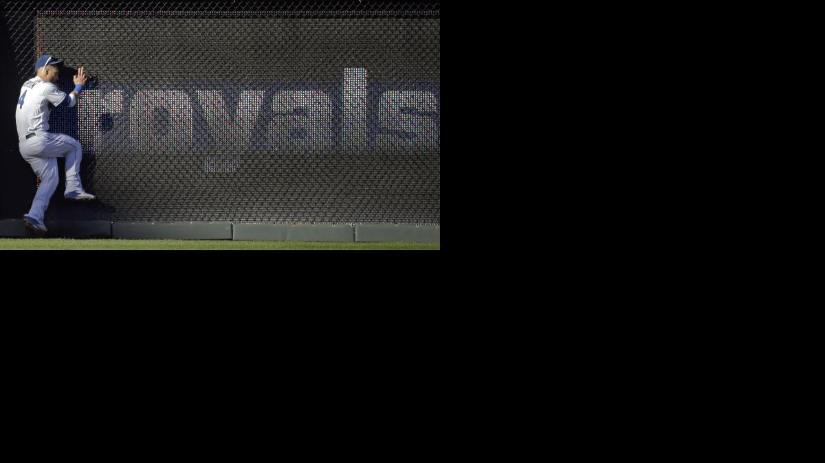
Royals left fielder Alex Gordon hits the fence after making a catch on a ball hit by Baltimore Orioles' J.J. Hardy during the fifth inning Wednesday in Kansas City, Mo. 
