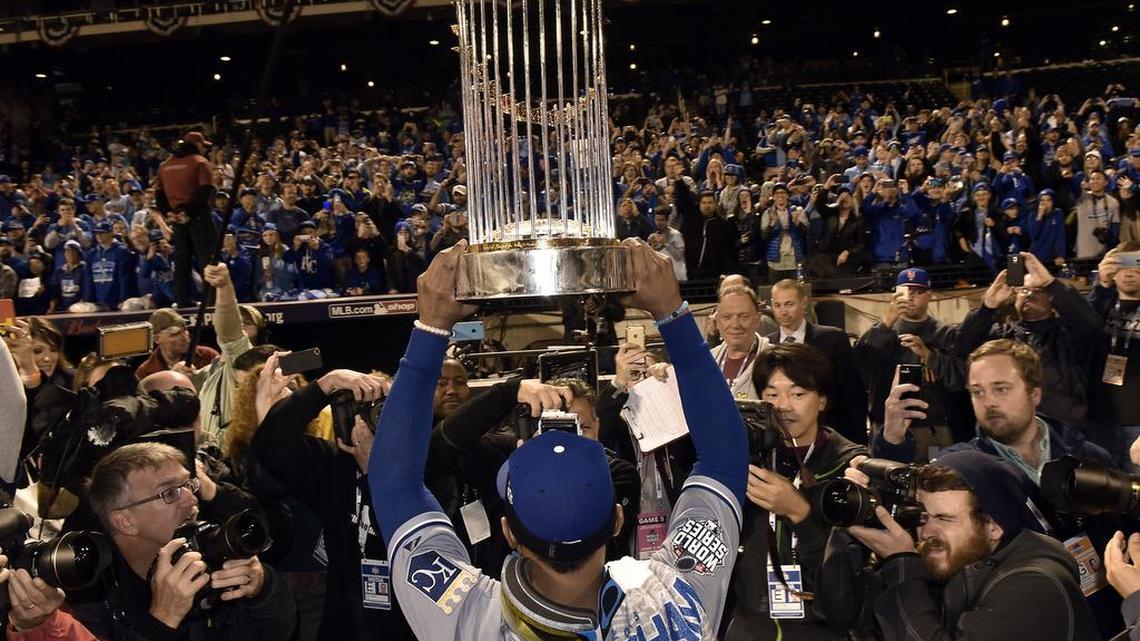 Kansas City Royals center fielder Jarrod Dyson held the World Series trophy up for fans to see after the Royals defeated the New York Mets 7-2 to win World Series on Sunday, November 1, 2015 at Citi Field in New York.
