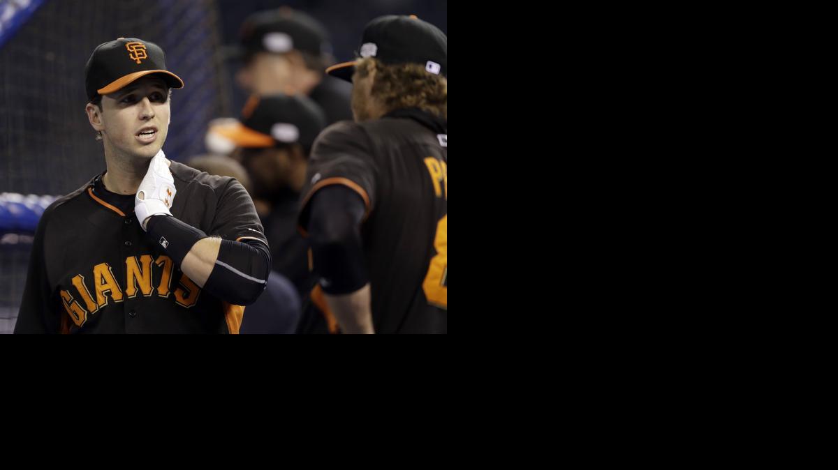 
San Francisco Giants' Buster Posey, left, talks with teammate Hunter Pence as they take batting practice during a workout on Monday in Kansas City, Mo. The Giants and Kansas City Royals are scheduled to play Game 6 of the World Series on Tuesday. 

