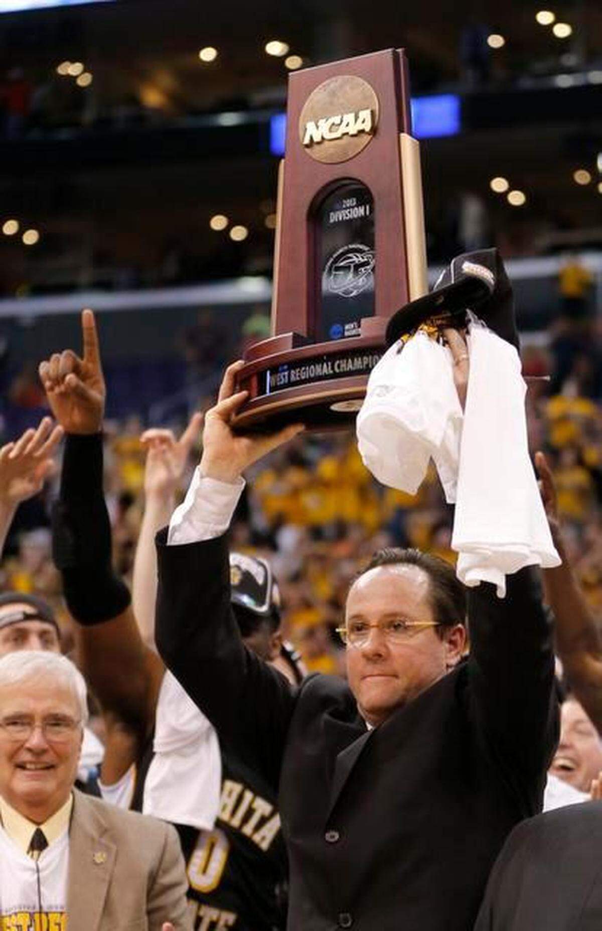 Wichita State Shockers head coach Gregg Marshall holds the West Region trophy after beating Ohio State in the NCAA Tournament regional final at Staples Center in Los Angeles. The team will advance to the Final Four in Atlanta. (March 30, 2013)