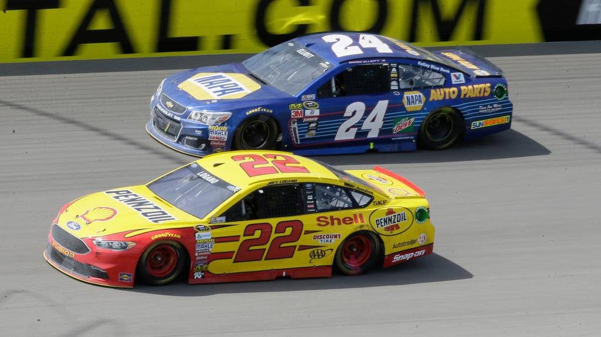 Joey Logano (22) leads Chase Elliott during the NASCAR Sprint Cup series race at Michigan International Speedway on Sunday in Brooklyn, Mich.