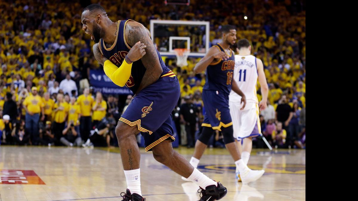 Cleveland Cavaliers forward LeBron James (23) celebrates after beating the Golden State Warriors in Game 2 of the NBA Finals on Sunday in Oakland, Calif. James finished with at triple-double.