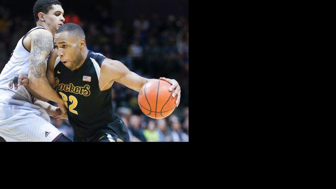 
Wichita State's Tekele Cotton, right, drives to the basket against Missouri State's Chris Kendrix in the second half at the JQH Arena in Springfield, MO., Wednesday. (Jan 21, 2015) 
