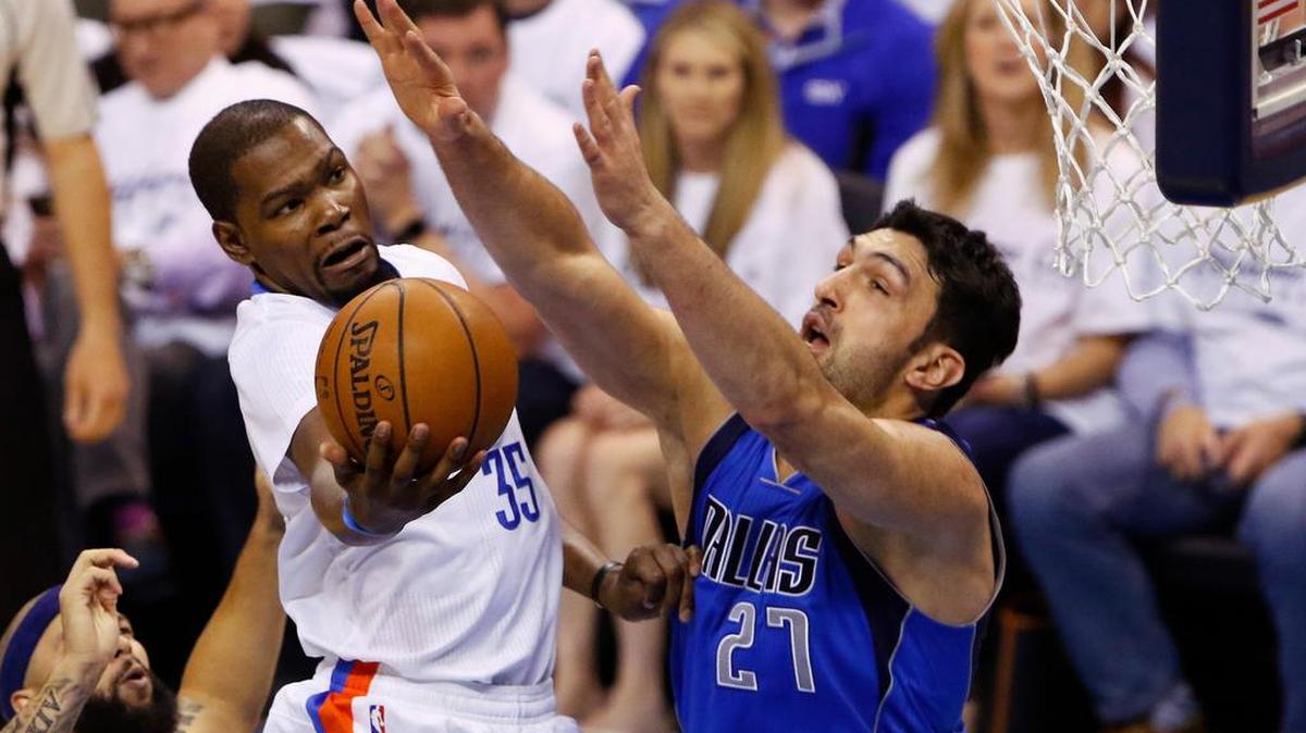 Oklahoma City Thunder forward Kevin Durant (35) goes to the basket as Dallas Mavericks center Zaza Pachulia (27) defends during the first half of Game 2 of a first-round NBA basketball playoff series, Monday, April 18, 2016, in Oklahoma City.