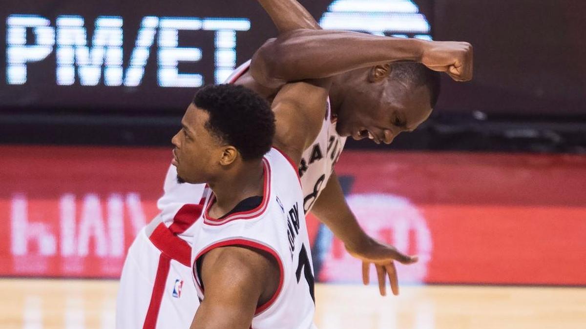 Toronto Raptors center Bismack Biyombo (8) celebrates with guard Kyle Lowry (7) while playing against the Cleveland Cavaliers during second half Eastern Conference final playoff basketball action in Toronto on Monday, May 23, 2016. Toronto won, 105-99.
