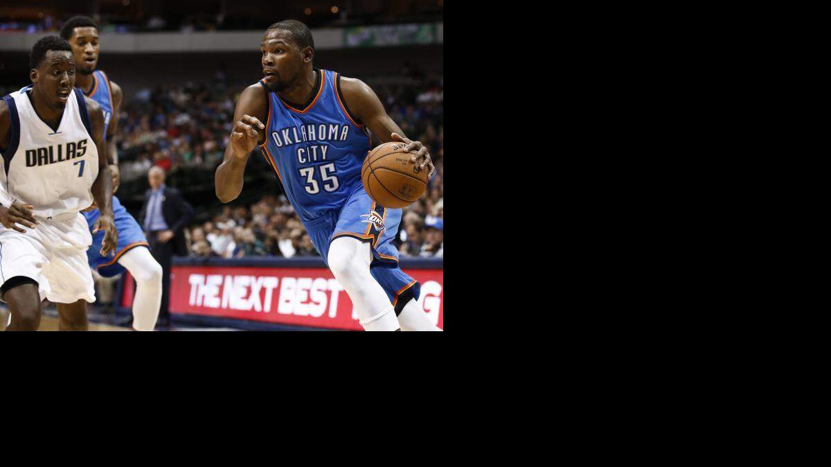 
Oklahoma City Thunder forward Kevin Durant (35) drives to the basket in front of Dallas Mavericks forward Al-Farouq Aminu (7) during the first half of a preseason NBA basketball game in Dallas on Friday. Durant has a fractured right foot and the NBA’s MVP seems likely to be sidelined for at least the start of the season. The team said Sunday in a statement that he was diagnosed with a Jones fracture — a broken bone at the base of the small toe. 
