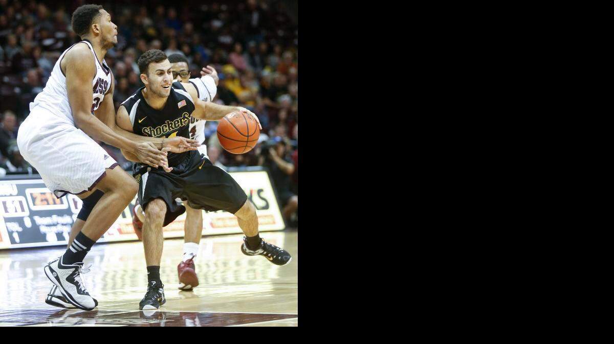 
Wichita State's John Robert Simon, right, works to penetrate on Missouri State's Gavin Thurman in the second half at the JQH Arena in Springfield, MO., Wednesday. (Jan 21, 2015) 

