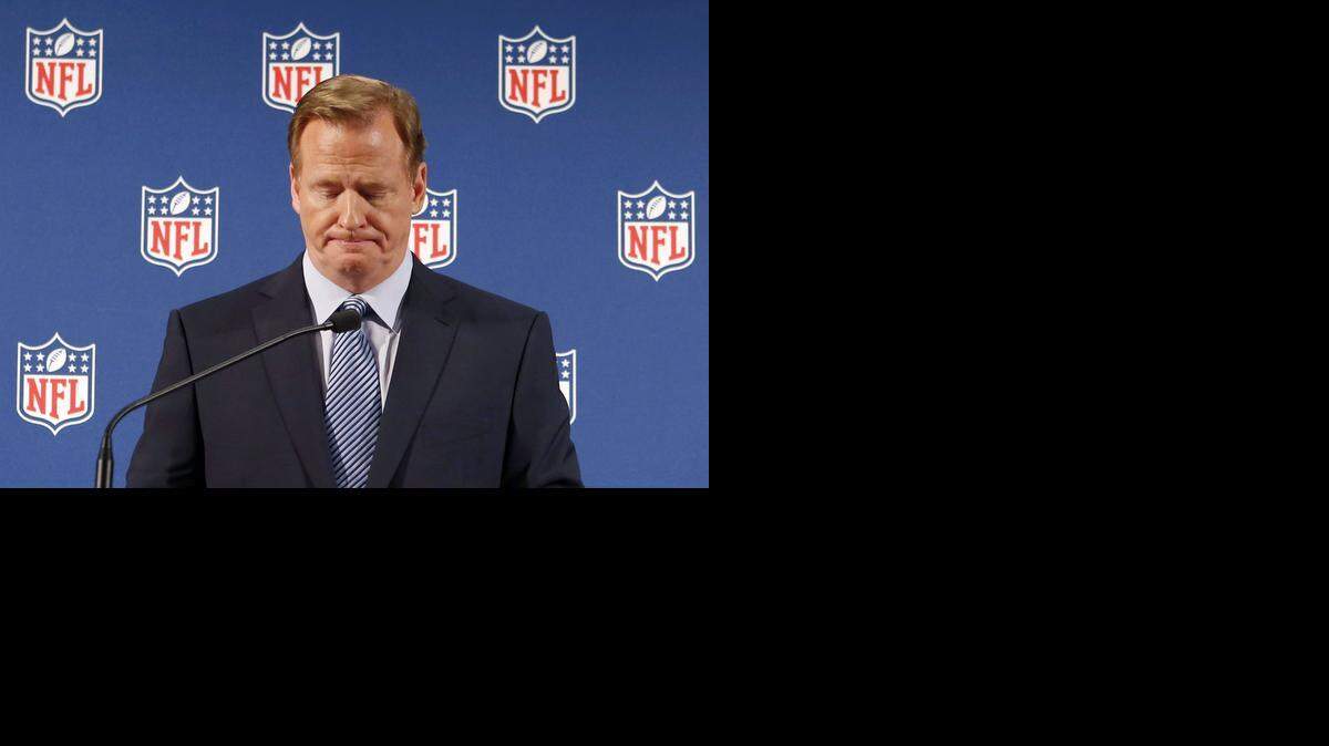 
NFL commissioner Roger Goodell pauses as he speaks during a news conference Friday.
