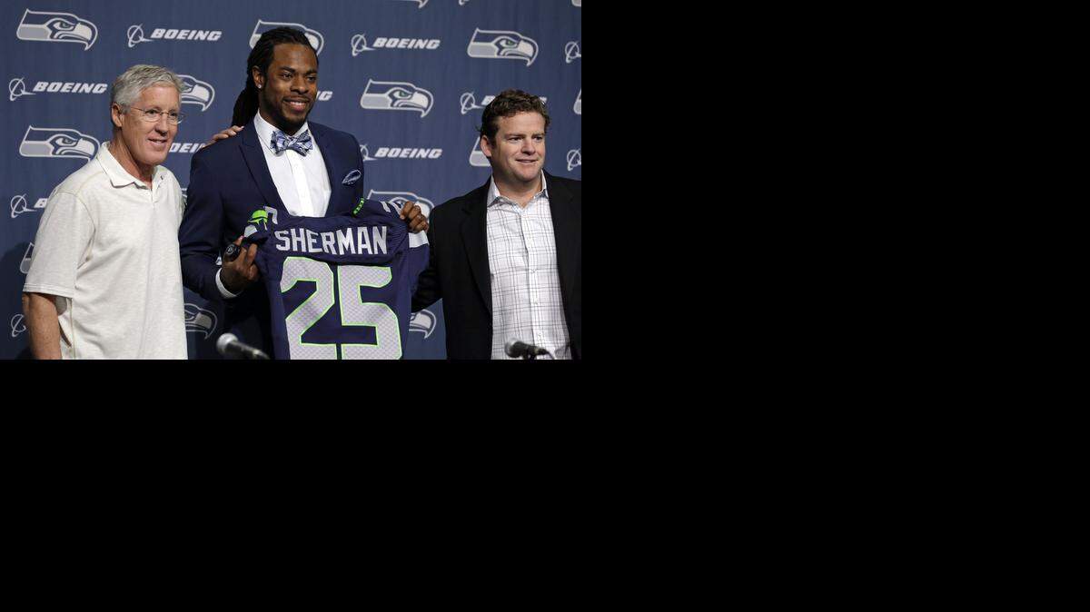 
Seattle Seahawks general manager John Schneider (right), who who posed with coach Pete Carroll (left) and cornerback Richard Sherman earlier this year, spent three years as the Chiefs’ director of pro personnel.
