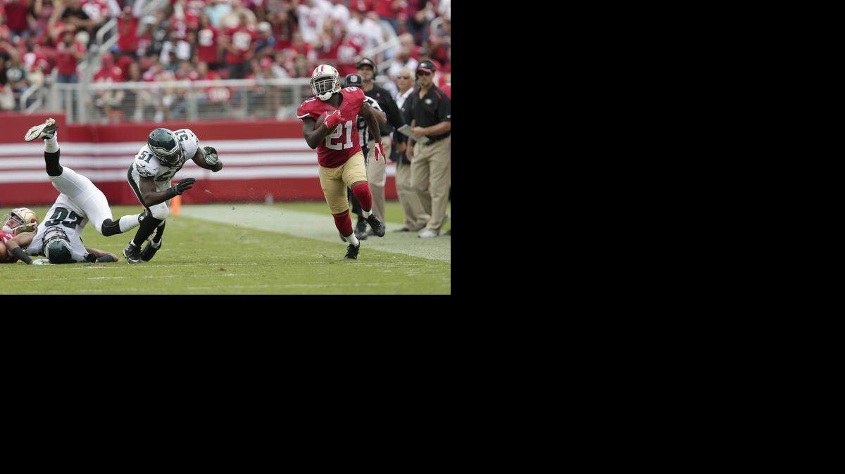 
San Francisco 49ers running back Frank Gore runs past the Eagles in last Sunday’s game.
