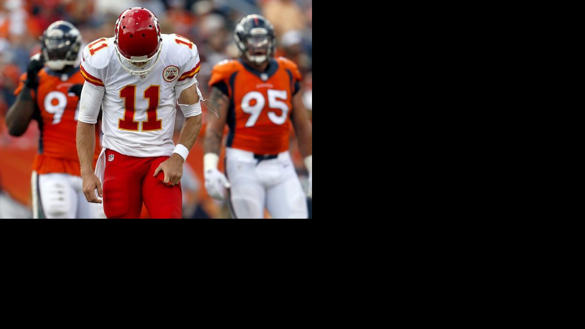
Kansas City’s Alex Smith (11) looks down after an incomplete pass against Denver during the second half Sunday in Denver. 
