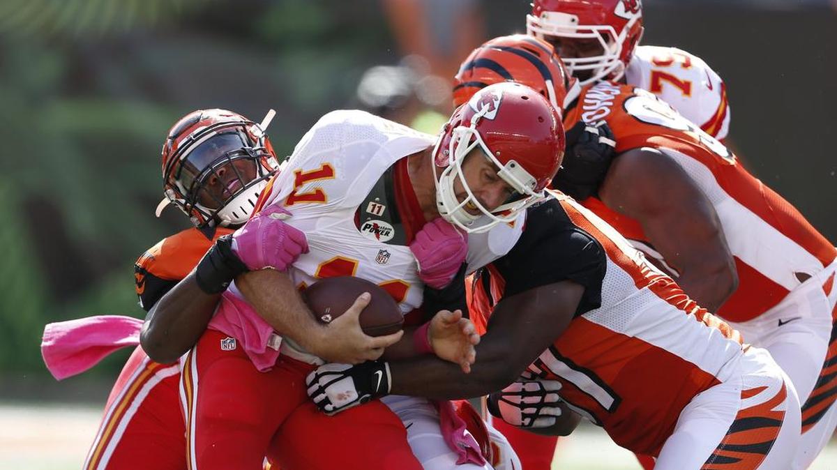 
Kansas City Chiefs quarterback Alex Smith (11) is sacked by Cincinnati Bengals defensive end Carlos Dunlap (96) in the second half of an NFL football game on Sunday in Cincinnati. (Oct. 4, 2015)
