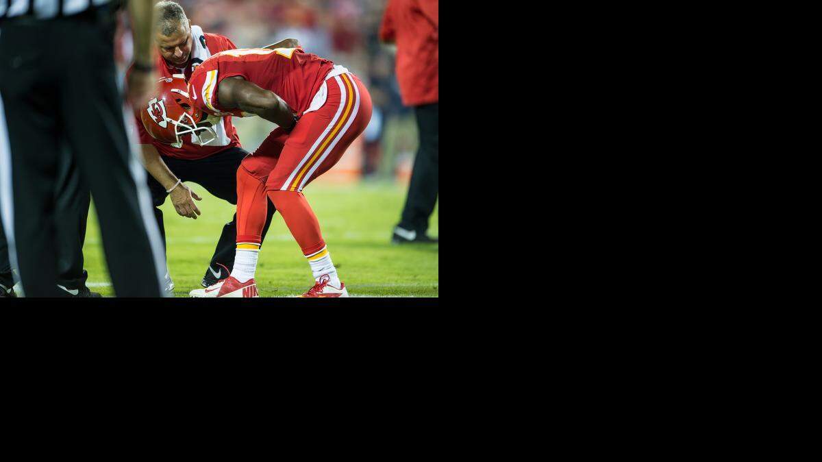 
Kansas City Chiefs wide receiver Donnie Avery was bent over in pain while trainer Rick Burkholder tried to help during Monday’s game against the New England Patriots at Arrowhead Stadium. 
