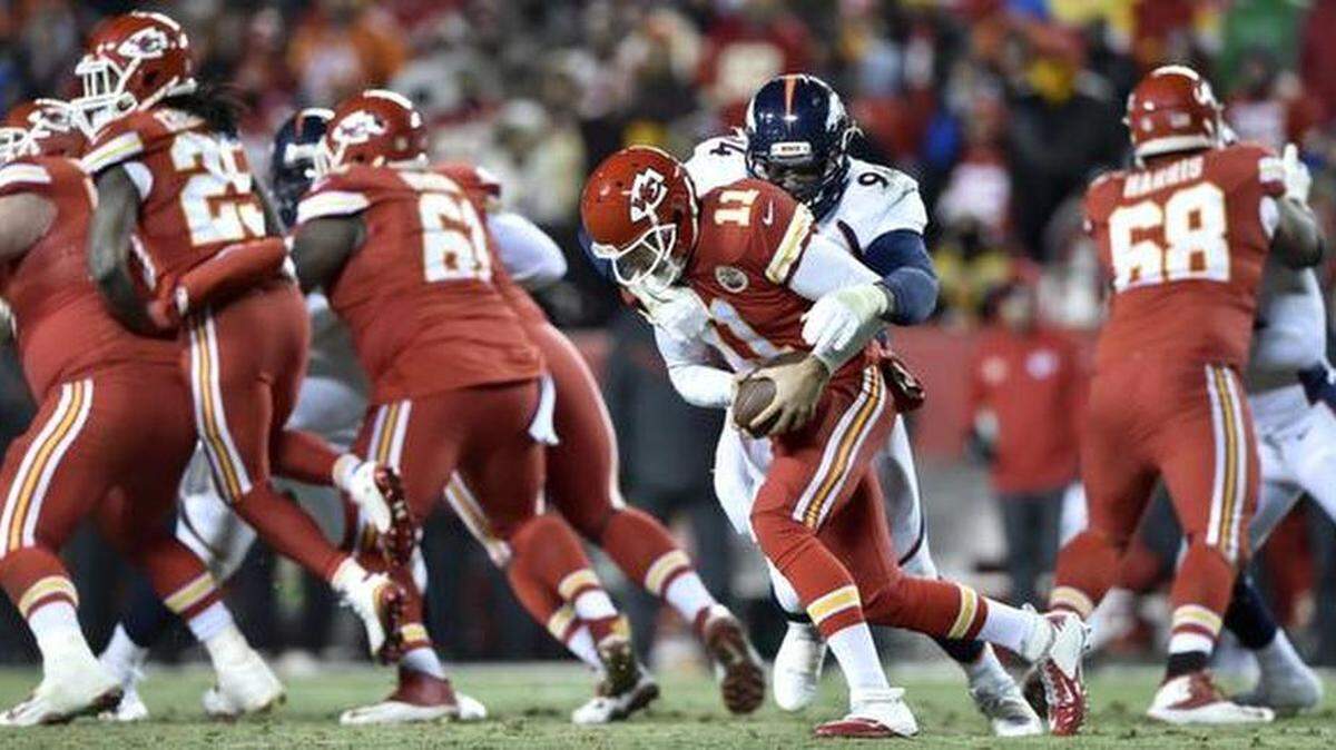 
Kansas City Chiefs quarterback Alex Smith (11) sacks Denver Broncos defensive end DeMarcus Ware (94) in the third quarter during the Kansas City Chiefs and Denver Broncos football game at Arrowhead Stadium on Sunday, November 30, 2014, in Kansas City, Mo..
