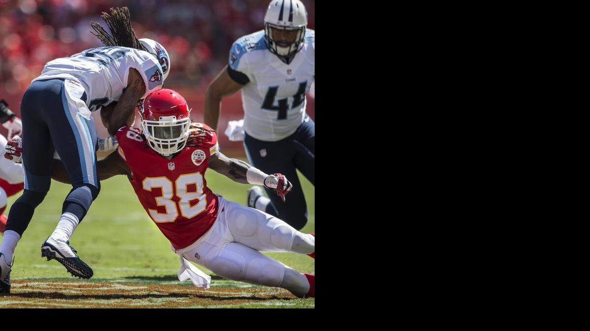 
Chiefs cornerback Ron Parker tackles Tennessee Titans running back Dexter McCluster during a 26-10 loss in the season-opener.
