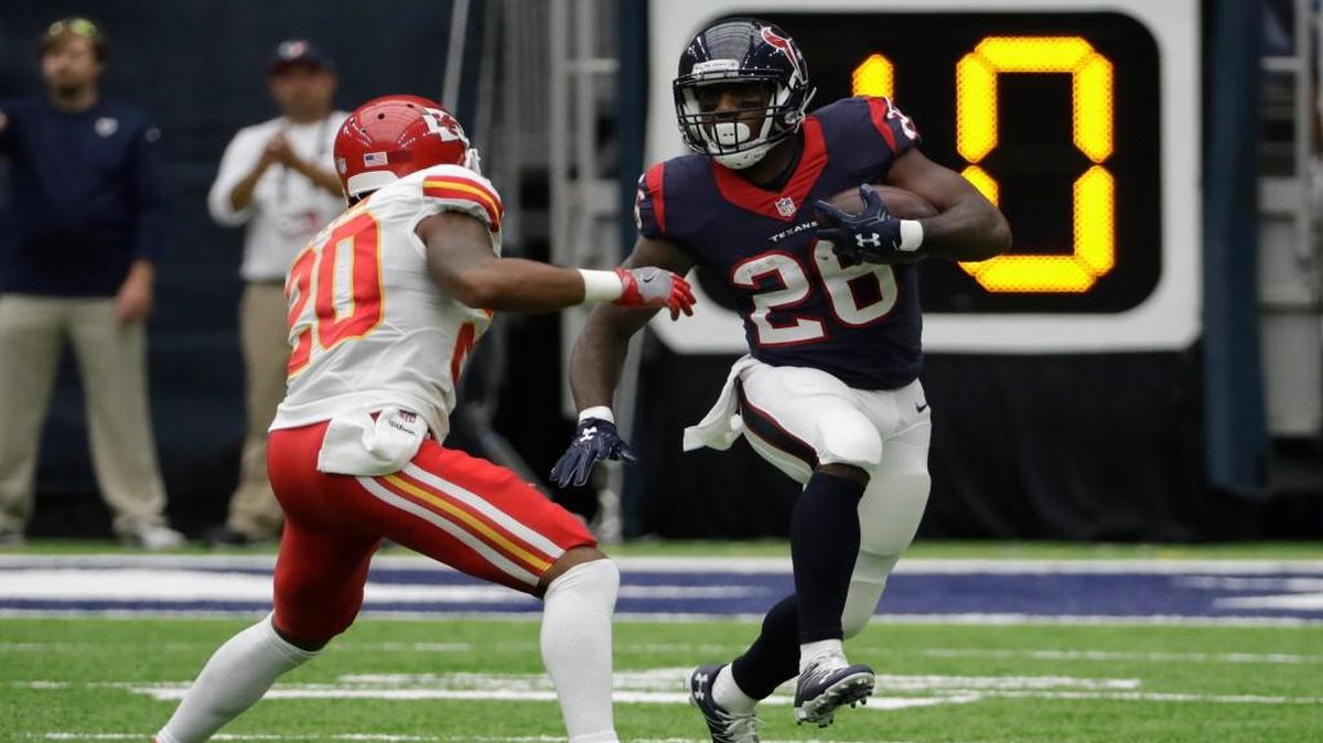 Chiefs cornerback Steven Nelson (20) tries to bring down Texans running back Lamar Miller on Sunday in Houston.