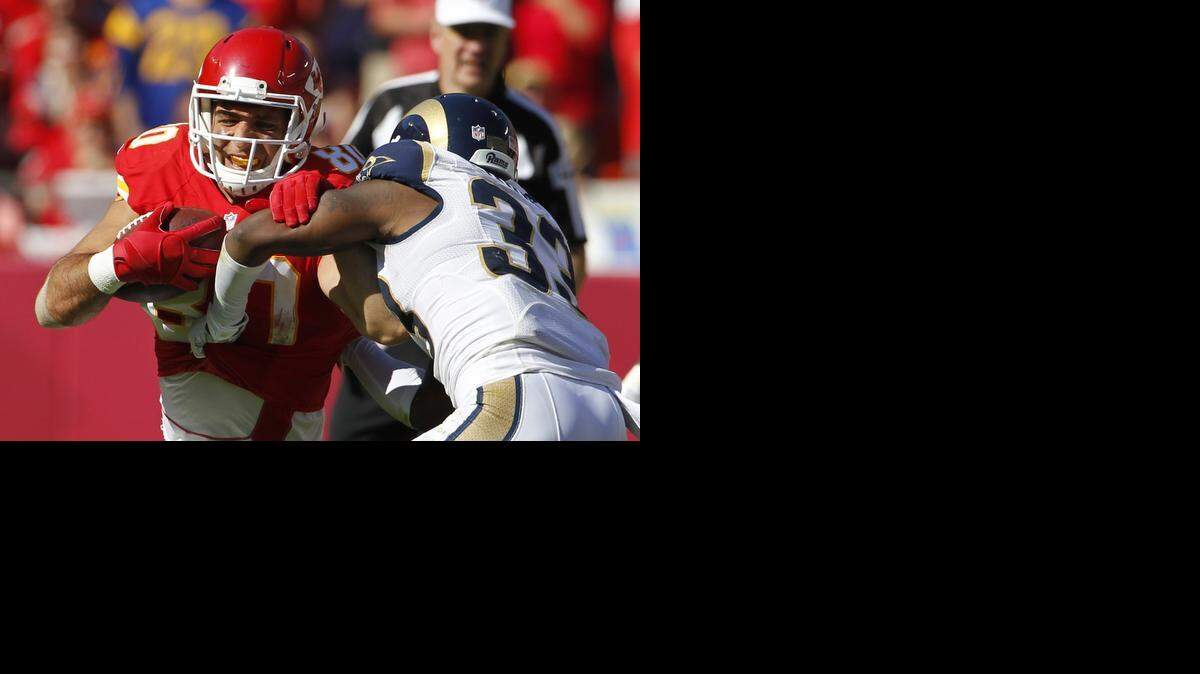 
Kansas City Chiefs tight end Anthony Fasano (80) is tackled by St. Louis Rams cornerback E.J. Gaines (33) in the second half of an NFL football game in Kansas City, Mo., Sunday (Oct. 26, 2014)
