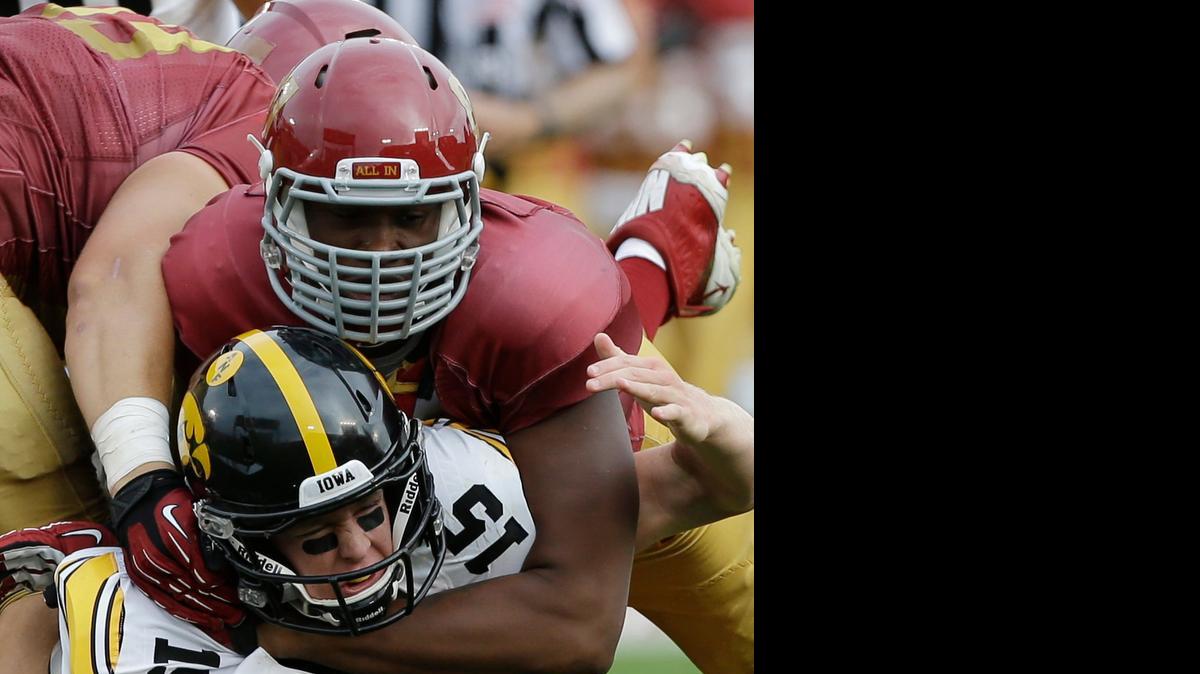 
David Irving, tackling Iowa quarterback Jake Rudock, has a fresh start.

