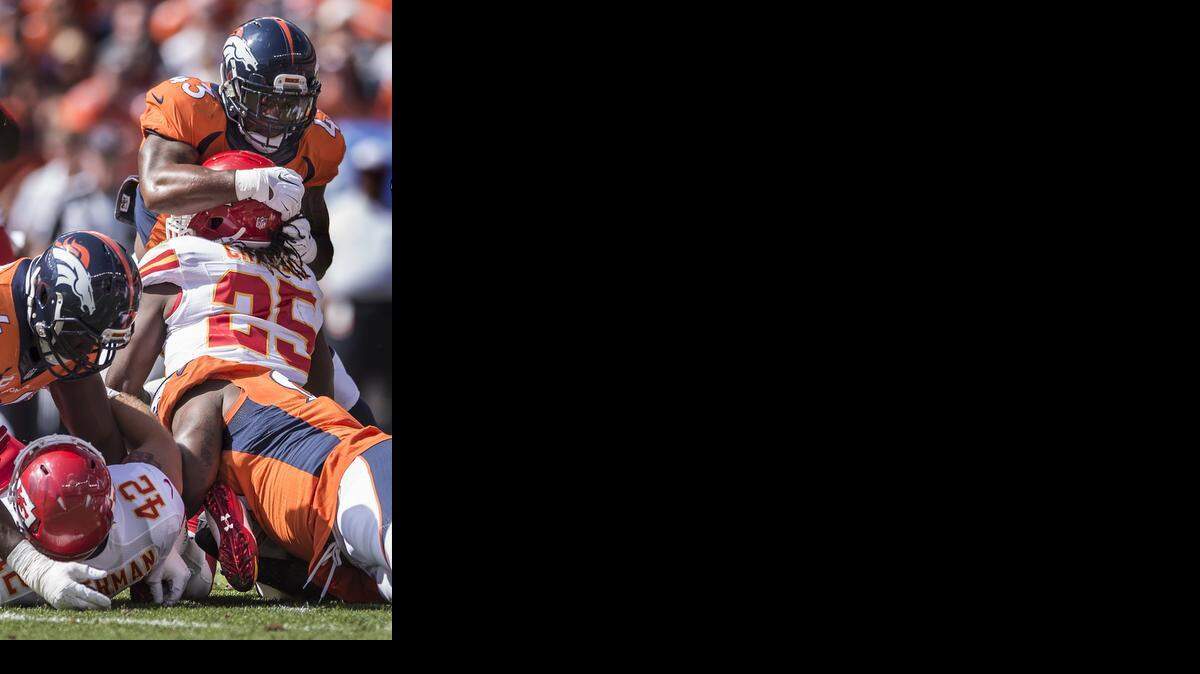 
Kansas City Chiefs running back Jamaal Charles (25) left the game after this first quarter play on a two-yard run against the Denver Broncos in NFL action on September 14, 2014 at Sports Authority Field at Mile High in Denver, Co. Charles did not return and the Chiefs lost 24-17.
