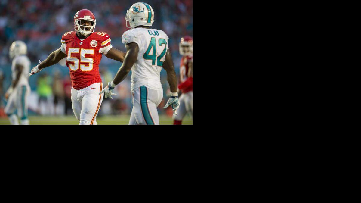 
Kansas City Chiefs linebacker Dee Ford (left) made the motion of incomplete pass on a near sack he made on Miami Dolphins quarterback Ryan Tannehill in the fourth quarter at Sun Life Stadium in Miami Gardens, Fla. on Sunday.
