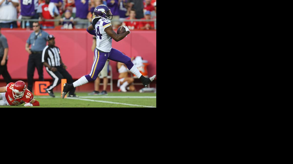 
Minnesota Vikings wide receiver Cordarrelle Patterson scores a touchdown as he runs past Kansas City Chiefs safety Daniel Sorensen during the first half Saturday in Kansas City, Mo. Patterson began his college career at Hutchinson Community College.
