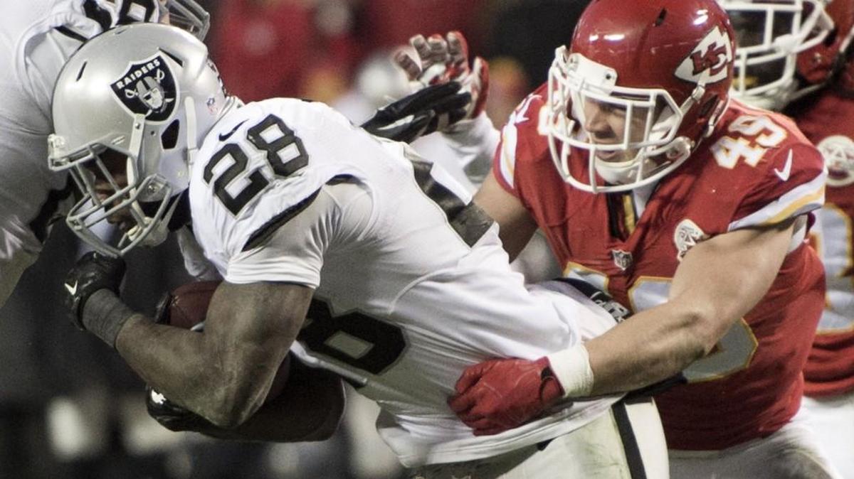 Chiefs defensive back Daniel Sorensen tackles Raiders running back Latavius Murray during a game last January.