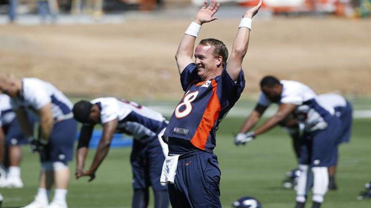 
Denver Broncos quarterback Peyton Manning was all smiles as he and his teammates prepared this summer to improve on their Super Bowl season of 2013.
