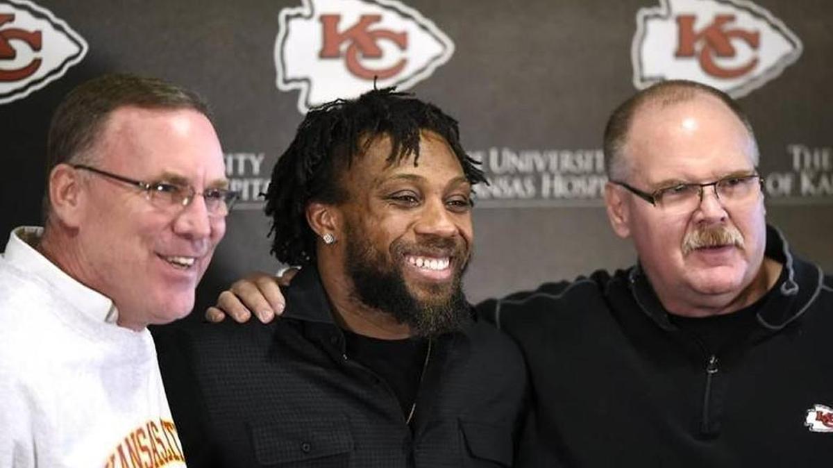 Chiefs general manager John Dorsey, left, and head coach Andy Reid flank Berry in March at Arrowhead Stadium.