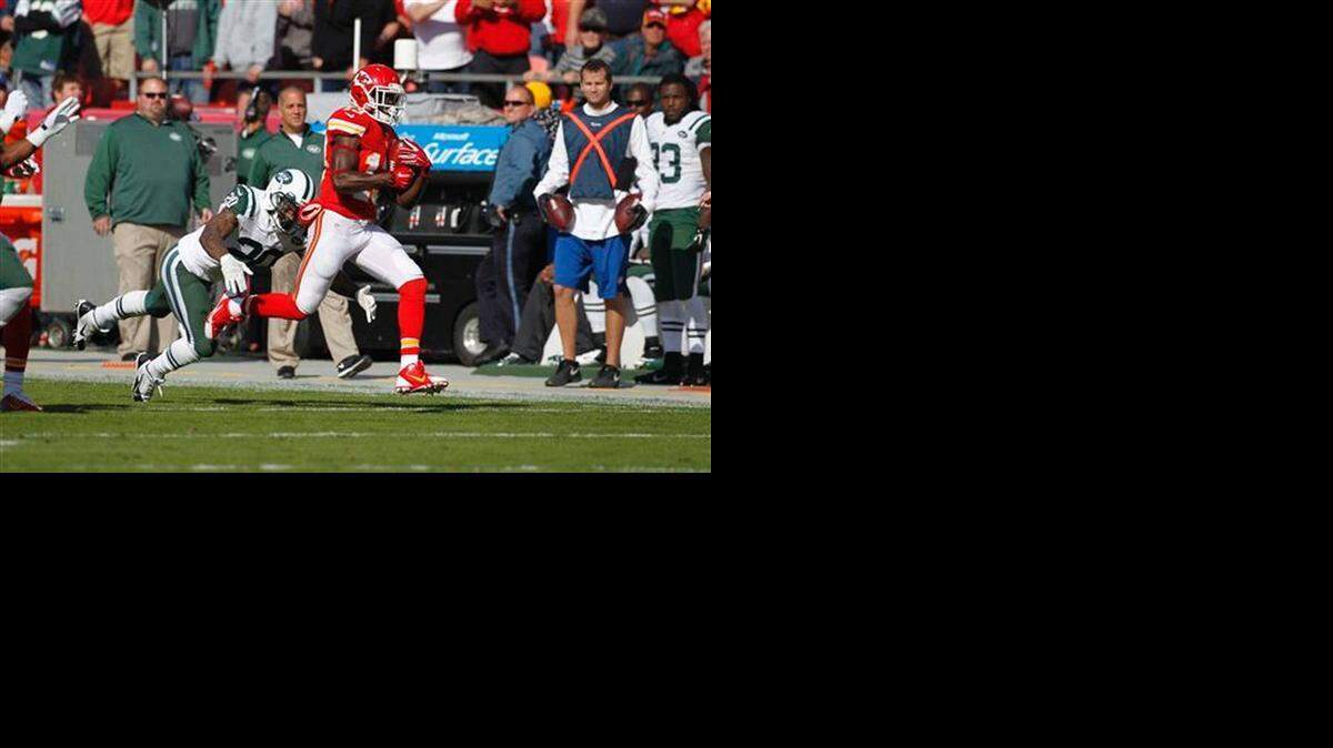 
De’Anthony Thomas runs away from Jets cornerback Kyle Wilson in the first half of Sunday’s game.
