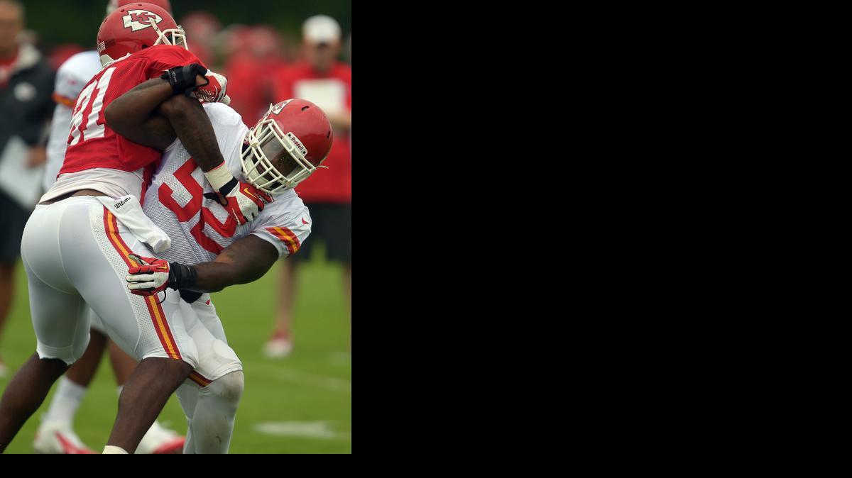 
Kansas City Chiefs linebacker James-Michael Johnson (52) tries to get past Richard Gordon (81) during practice Sunday morning, Aug. 10, 2014, on the Missouri Western State University campus in St. Joseph. Mo. (AP Photo/St. Joseph News-Press, Todd Weddle) 

