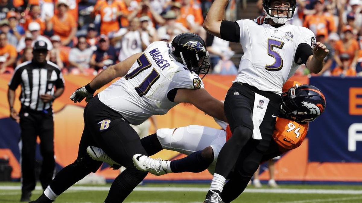 
Baltimore Ravens quarterback Joe Flacco was sacked by Broncos linebacker DeMarcus Ware, one of two Denver sacks on Sunday.
