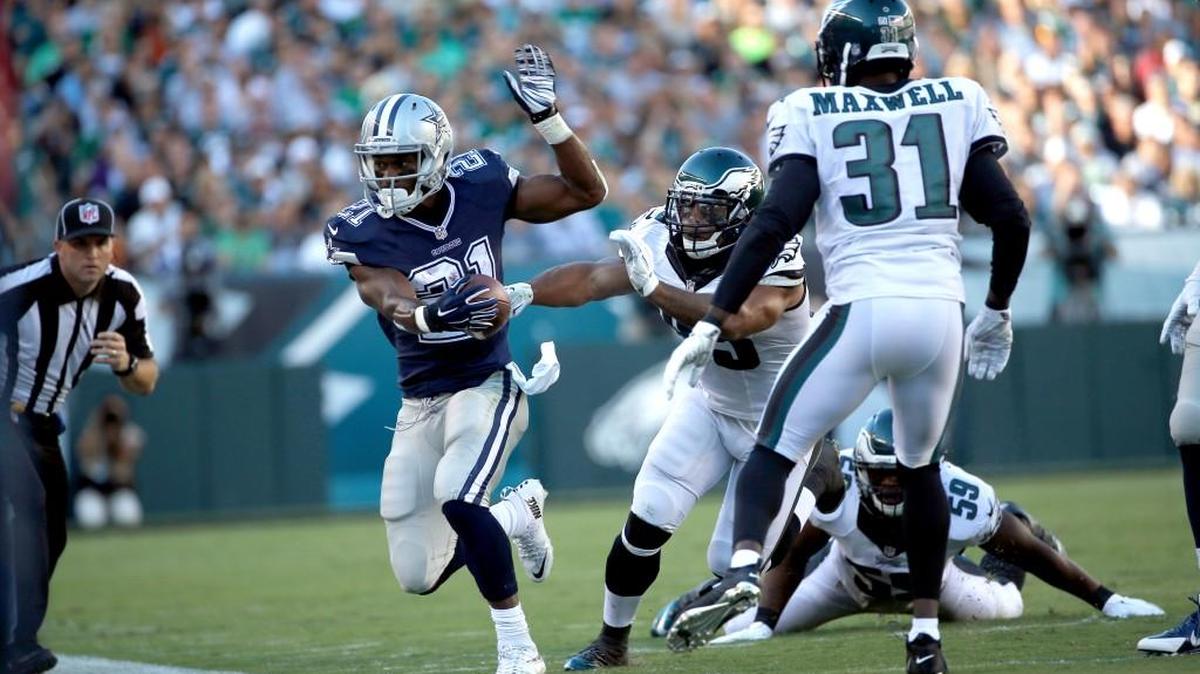 
The Cowboys' Joseph Randle (21) is shoved out of bounds during the first half Sunday in Philadelphia.
