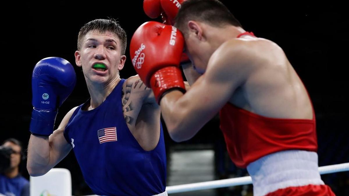 Nico Hernandez, left, fights Uzbekistan's Hasanboy Dusmatov during the Olympic light flyweight semifinals Aug. 12 in Rio de Janeiro.