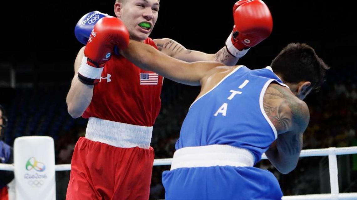 Wichitan Nico Hernandez, left, lands a left hand against Italy's Manuel Cappai during a men's light flyweight first-round match Saturday in Rio.