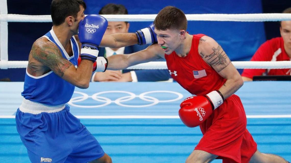 Wichitan Nico Hernandez, right, fights Italy's Manuel Cappai in Saturday’s first-round bout in the light flyweight (108 pounds) division. Hernandez won and fights Monday in the second round.