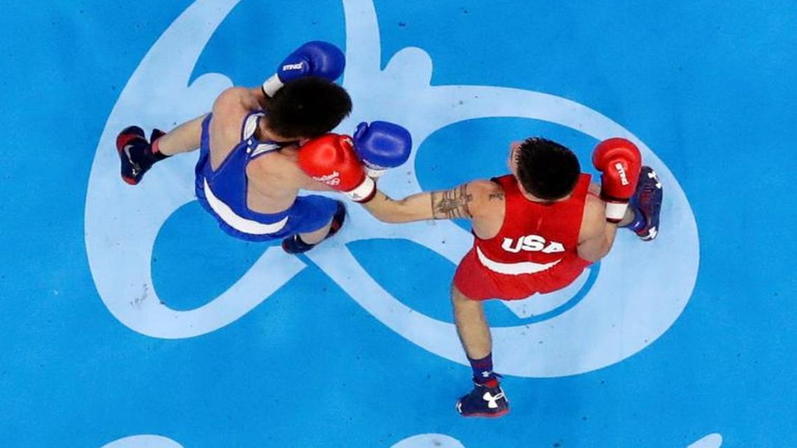 Wichita’s Nico Hernandez, right, punches Russia's Vasilii Egorov during a round-of-16 match Monday in Rio de Janeiro. Hernandez competes in Wednesday’s quarterfinals.