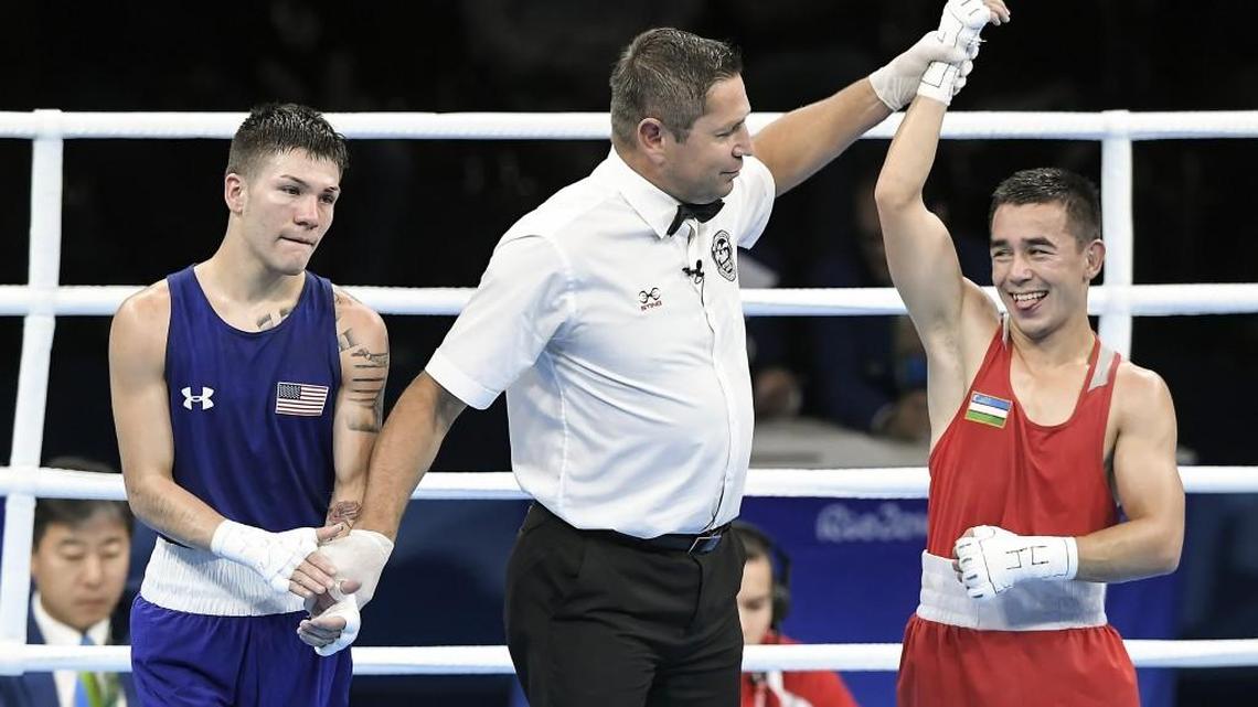 United States boxer Nico Hernandez, left, applauds Uzbekistan's Hasanboy Dusmatov after Dusmatov’s unanimous decision in the light flyweight semifinals Friday in Rio de Janeiro.