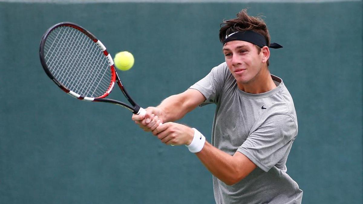 Cameron Norrie returns a ball to Jared Hiltzik in the singles finals of the Wichita Tennis Open in 2016. The free tournament concludes this weekend at Wichita State's Coleman Tennis Complex.