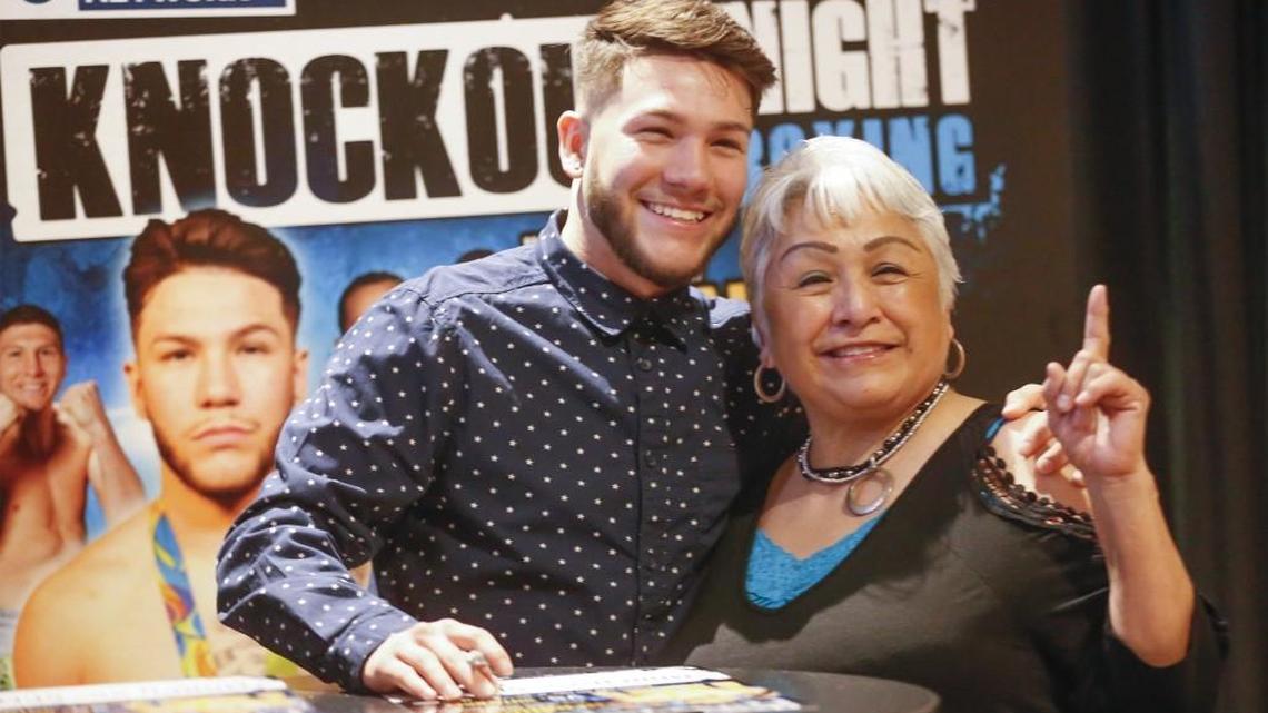 Olympic medalist Nico Hernandez poses with his grandmother Roseanna Hernandez as he signs autographs for fans Thursday at the Kansas Star Casino, where he announced his first pro fight. Hernandez will fight 20-year-old Patrick Gutierrez from Las Vegas on March 25 at the casino. (Feb 16, 2017)