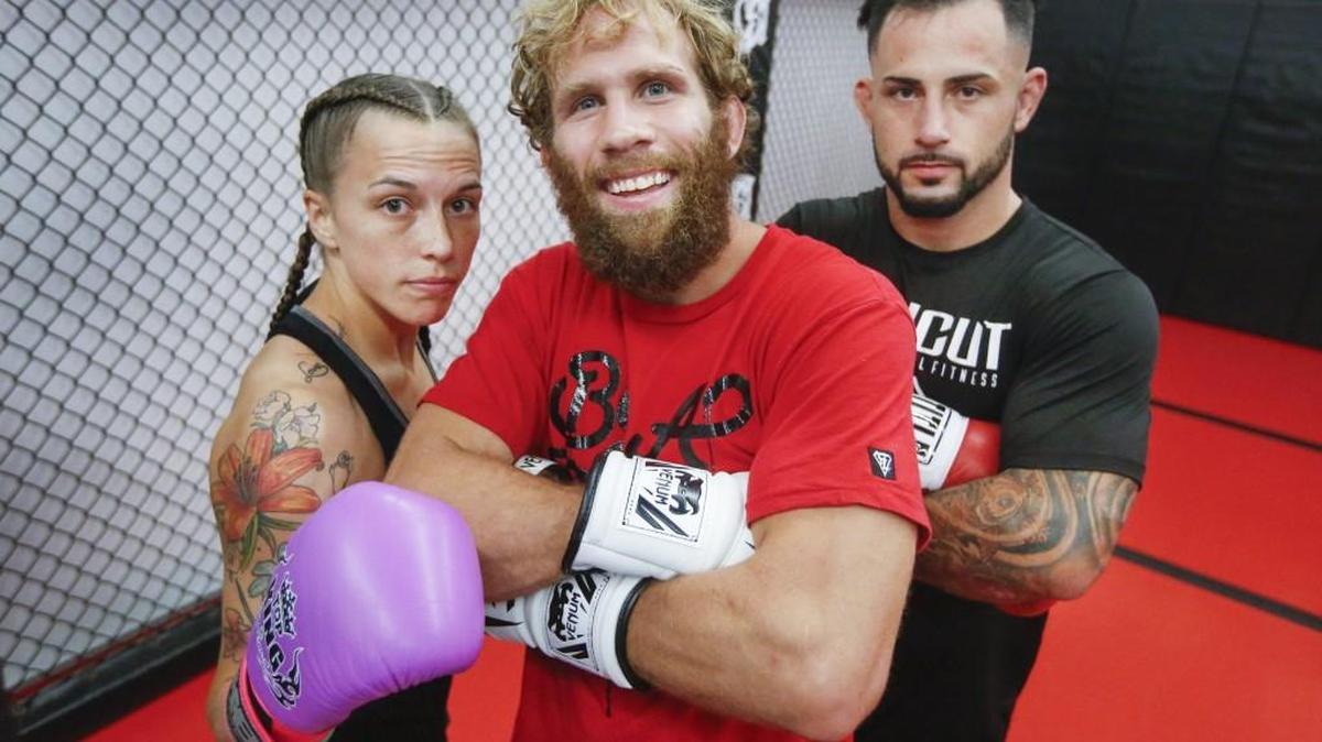 Local MMA fighter David Rickels, center, has opened the doors for other local MMA fighters such as Jessica Middleton, left, and Chris Harris.