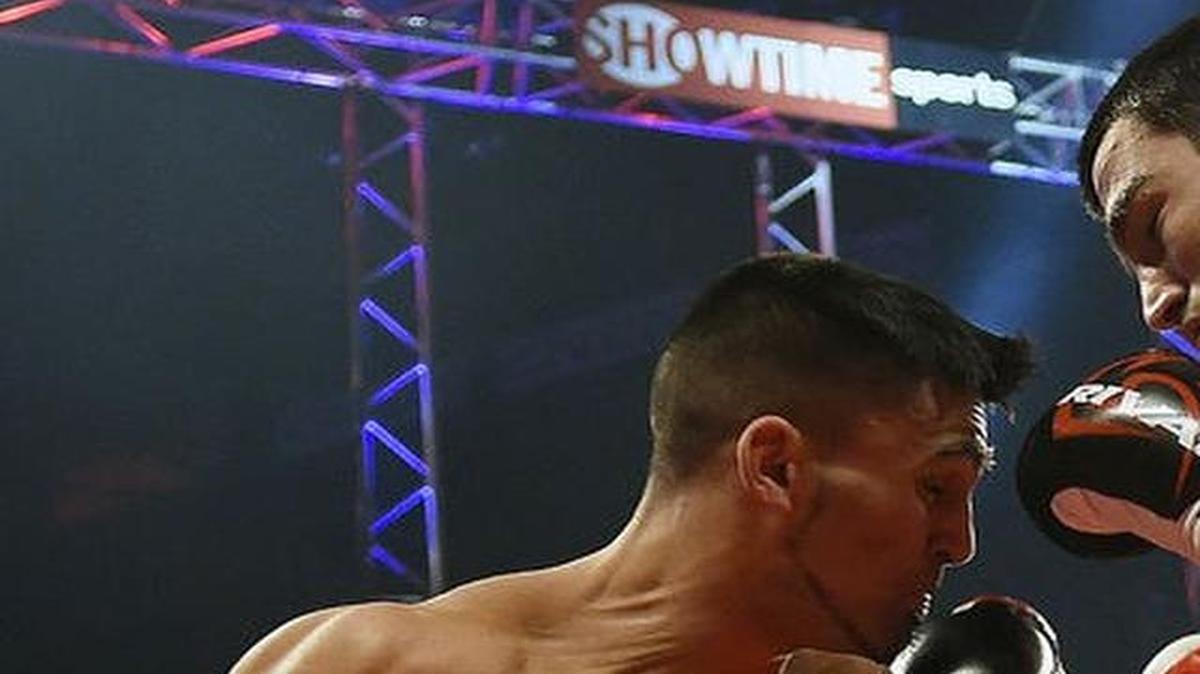 
Andover native Jeff Page Jr., left, takes a shot from Artur Beterbiev during their light heavyweight fight on Dec. 19 in Quebec City, Quebec. Page Jr. lost by knockout.
