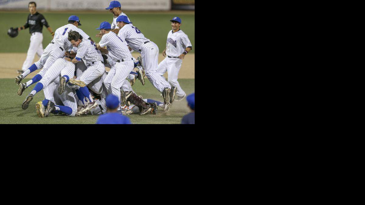 
The Santa Barbara players dog pile on top of pitcher Troy Cruz after they defeated the Seattle Studs 3-2 in the NBC Tournament championship game Saturday at Lawrence Dumont Stadium.
