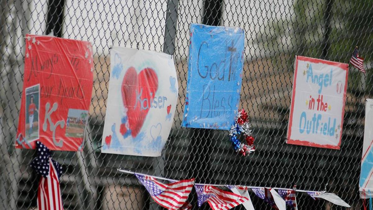 
Signs hang on a fence at Brent Gould Field, Tuesday morning, Aug. 11, 2015, in Liberal, Kan., in honor of Kaiser Carlile, the 9-year-old bat boy that was accidentally hit near the on-deck circle before a baseball game Aug. 1. 

