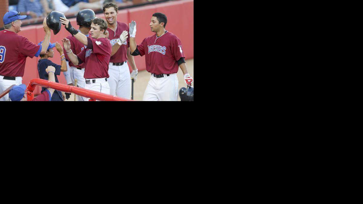 
Santa Barbara's Jake Vickerson, center, and Steven Reveles, right, are greeted by teammates after scoring in the eighth inning Friday during the NBC World Series at Lawrence-Dumont Stadium.
