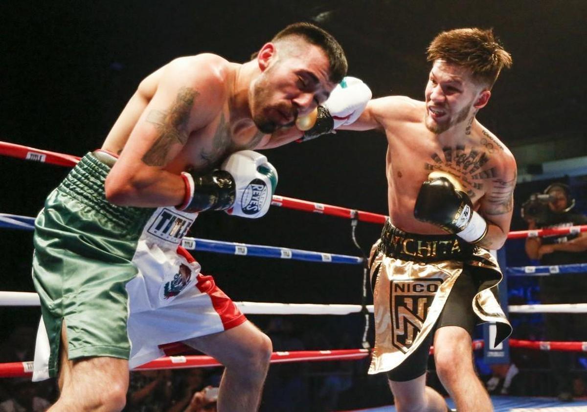 Nico Hernandez fights Jose Rodriguez in the first round during their flyweight bout at the KO Night Boxing event at Hartman Arena.